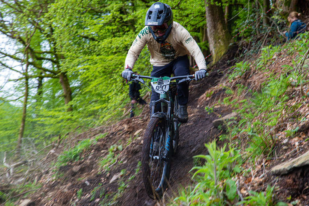 As riders left the dense woodland they faced loose loamy turns