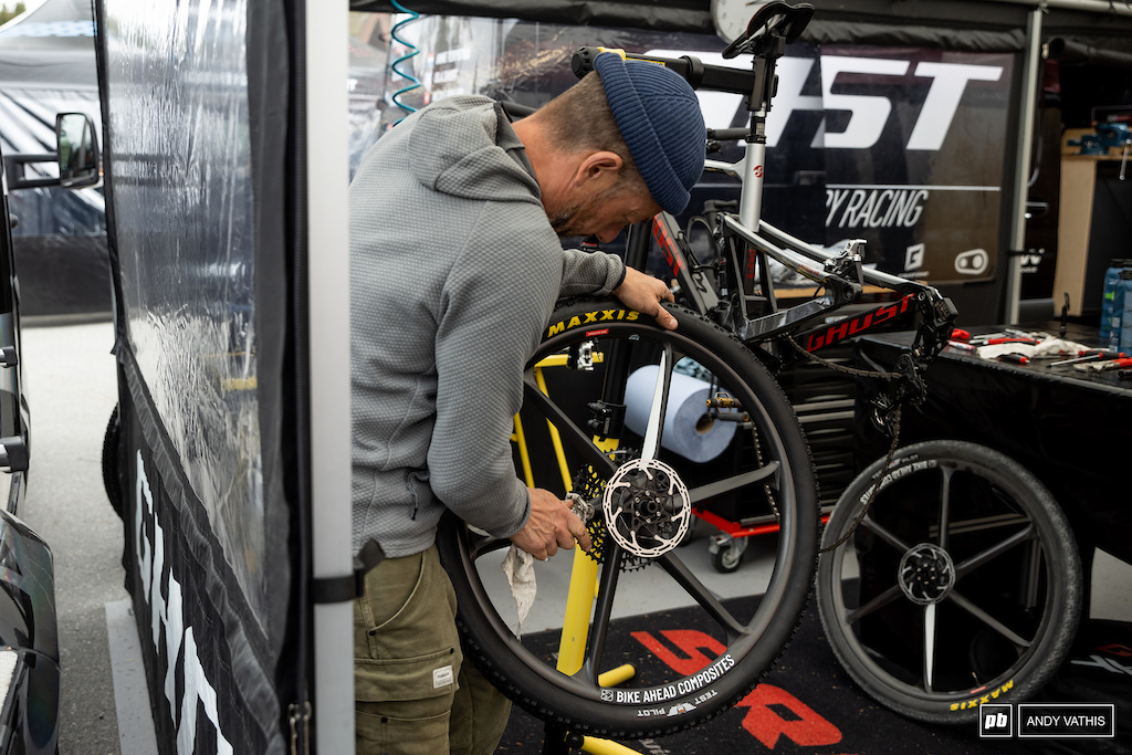 Wheels and parts being cleaned and remounted in the Ghost pits.