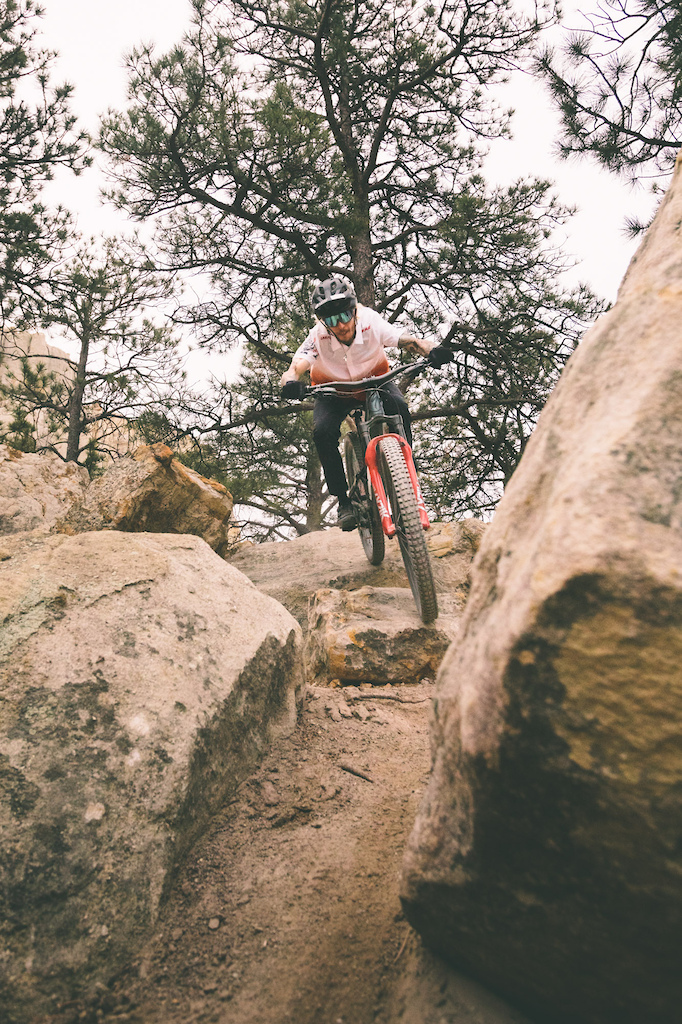 Criterium Bike Shop employee Justin Martin navigates a steep rocky line on Black Sheep Trail at Austin Bluffs Open Space in Colorado Springs Colorado.