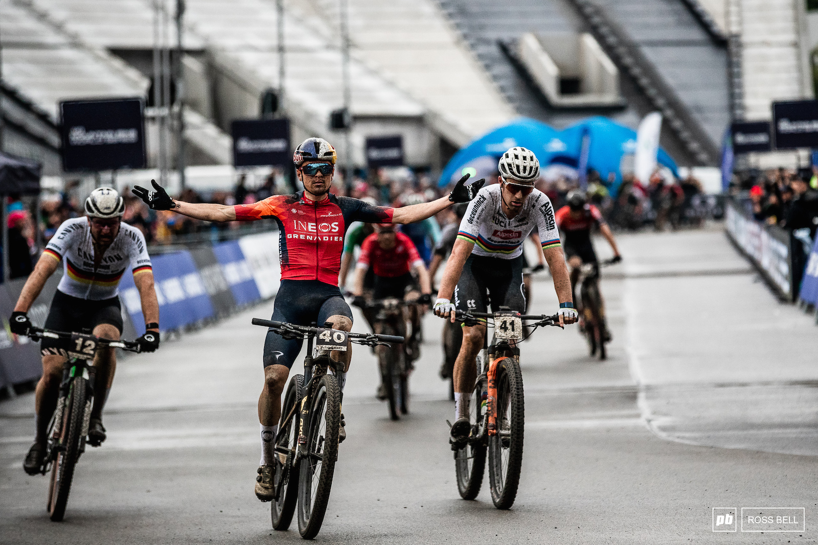 Tom Pidcock gets the better of Sam Gaze and Luca Schwarzbauer on the charge to the line.