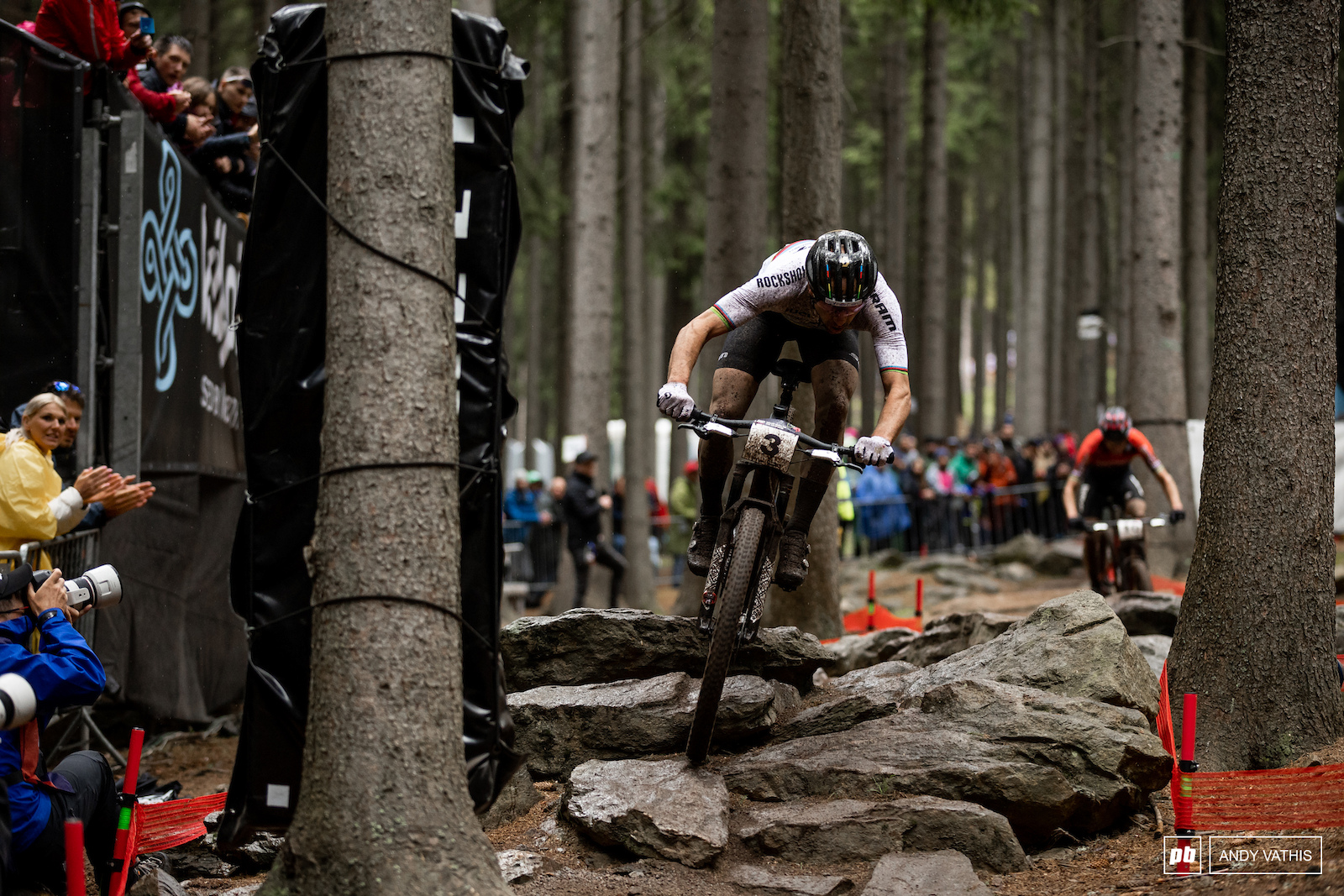 Nino Schurter up and over the rocks just passing Sarrou for third.