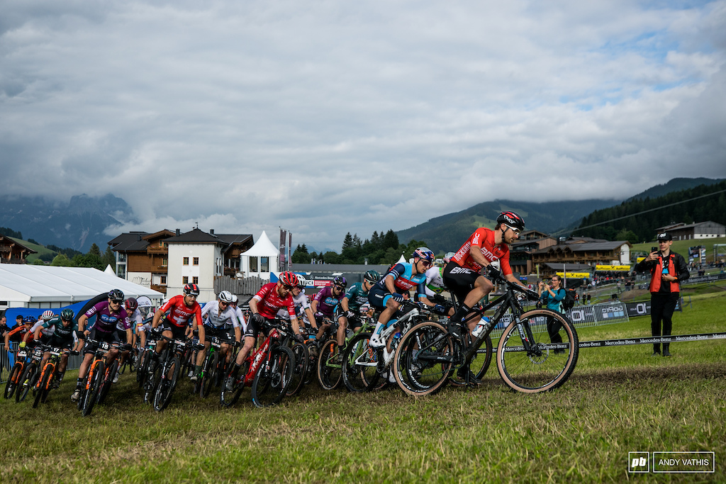 The men turn the first corner packed like sardines.