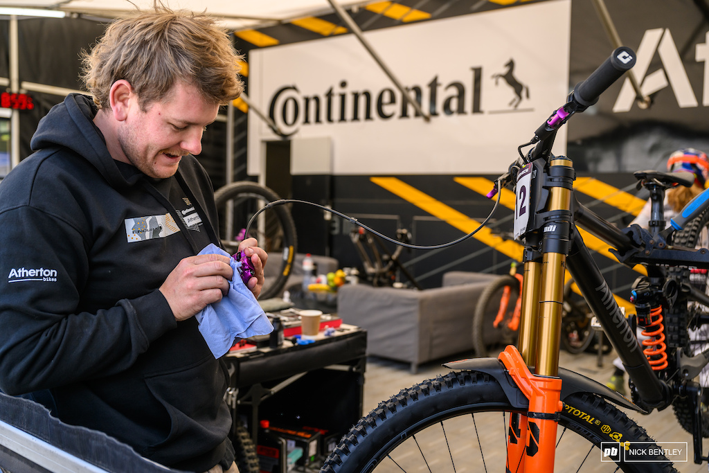 Some bright purple Hayes Dominion A4 brakes getting some attention in the continental Atherton pit