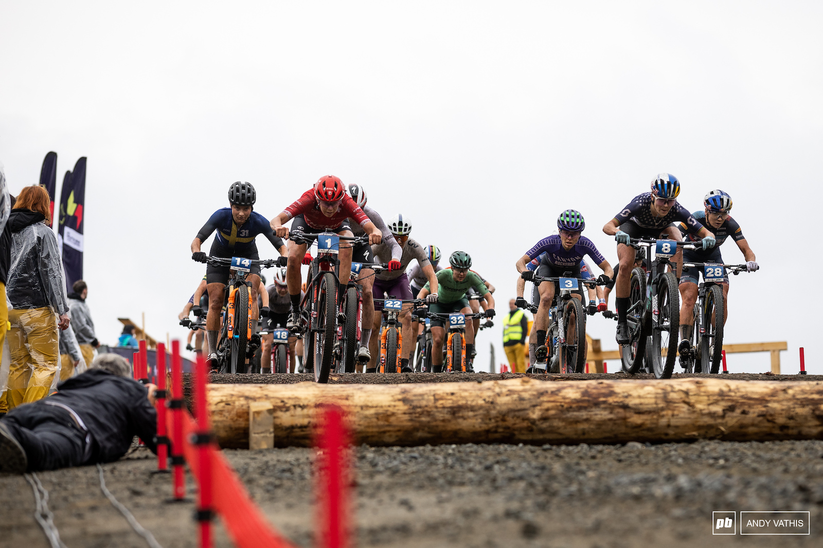 The women charge down the log drops still in a massive group halfway through the race.