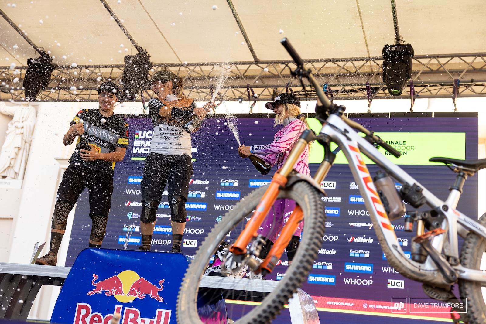 Morgane Charre Gloria Scarsi and Isabeau Courdurier wash off the dust with a little champagne from atop the podium in Finale