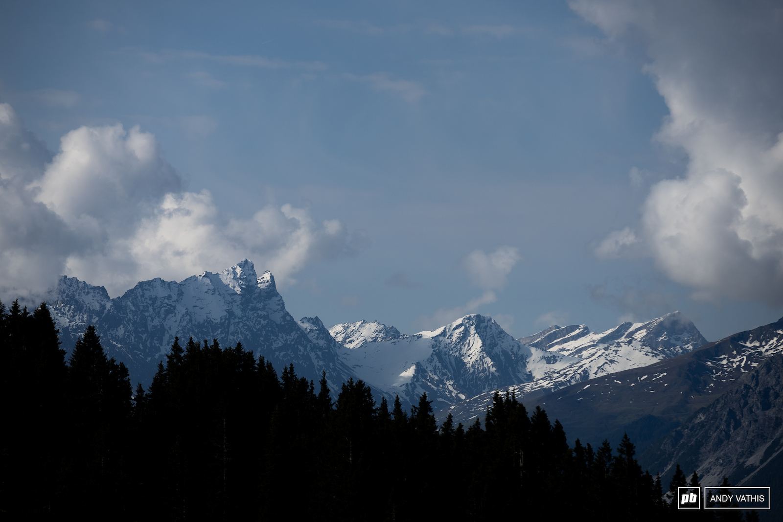 The Swiss Alps peering over the treeline into the venue.